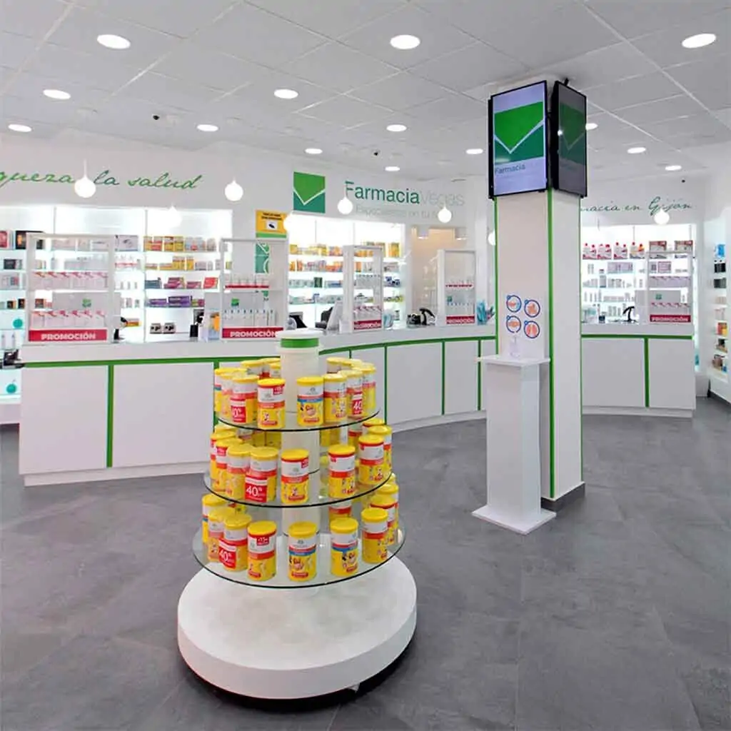 Interior view of Farmacia Vegas in Gijón — pharmaceutical service area.